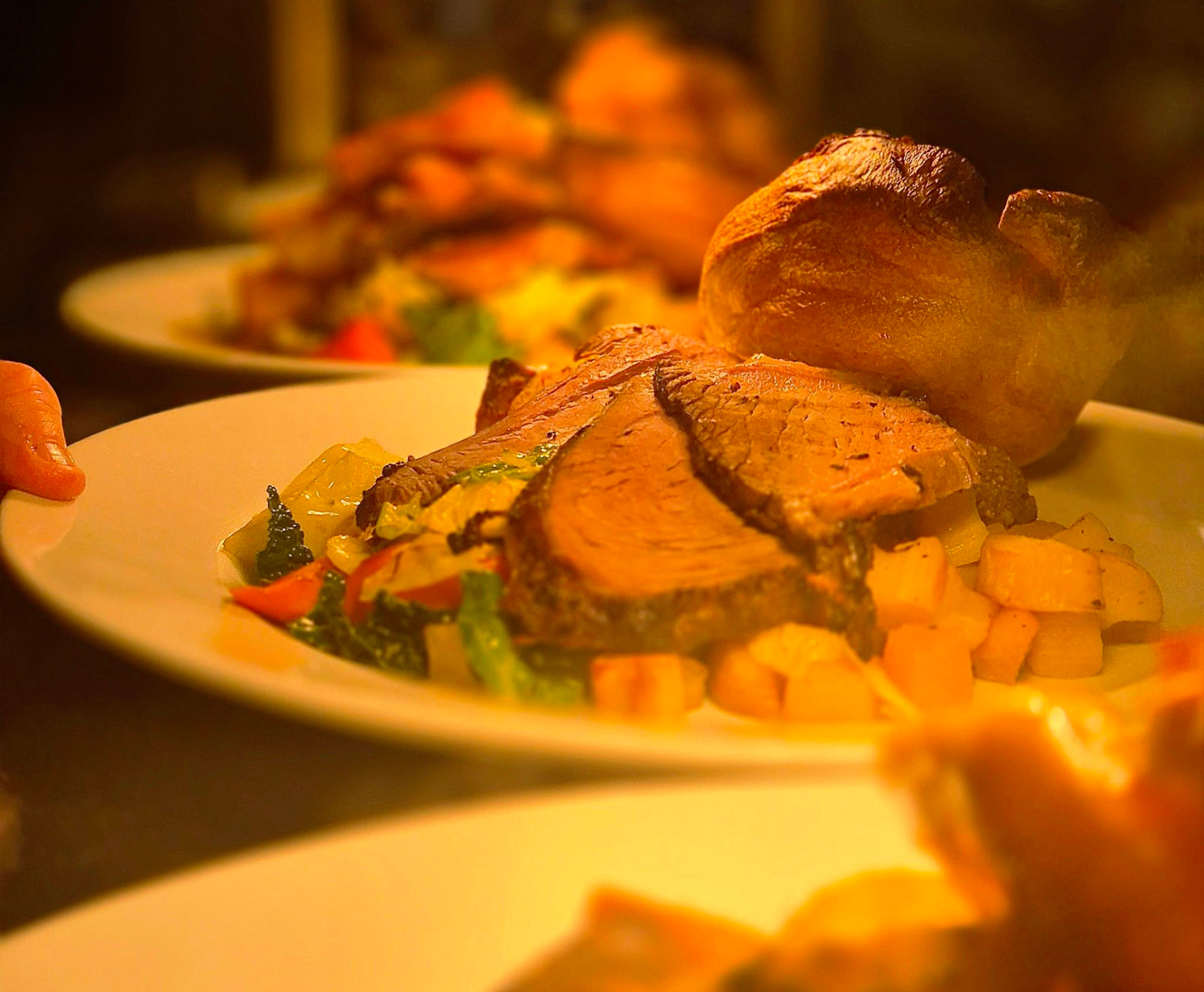 Sunday dinners plated up on the pass at The Wellington Inn kitchen