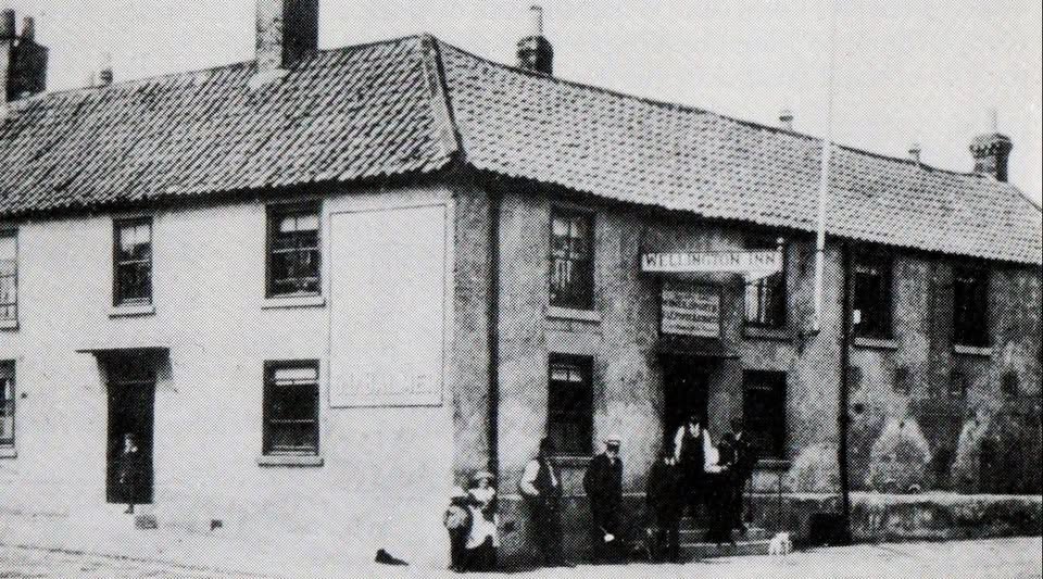 Historic photograph of The Wellington Inn, Wolviston, around 1902, with villagers and a horse outside
