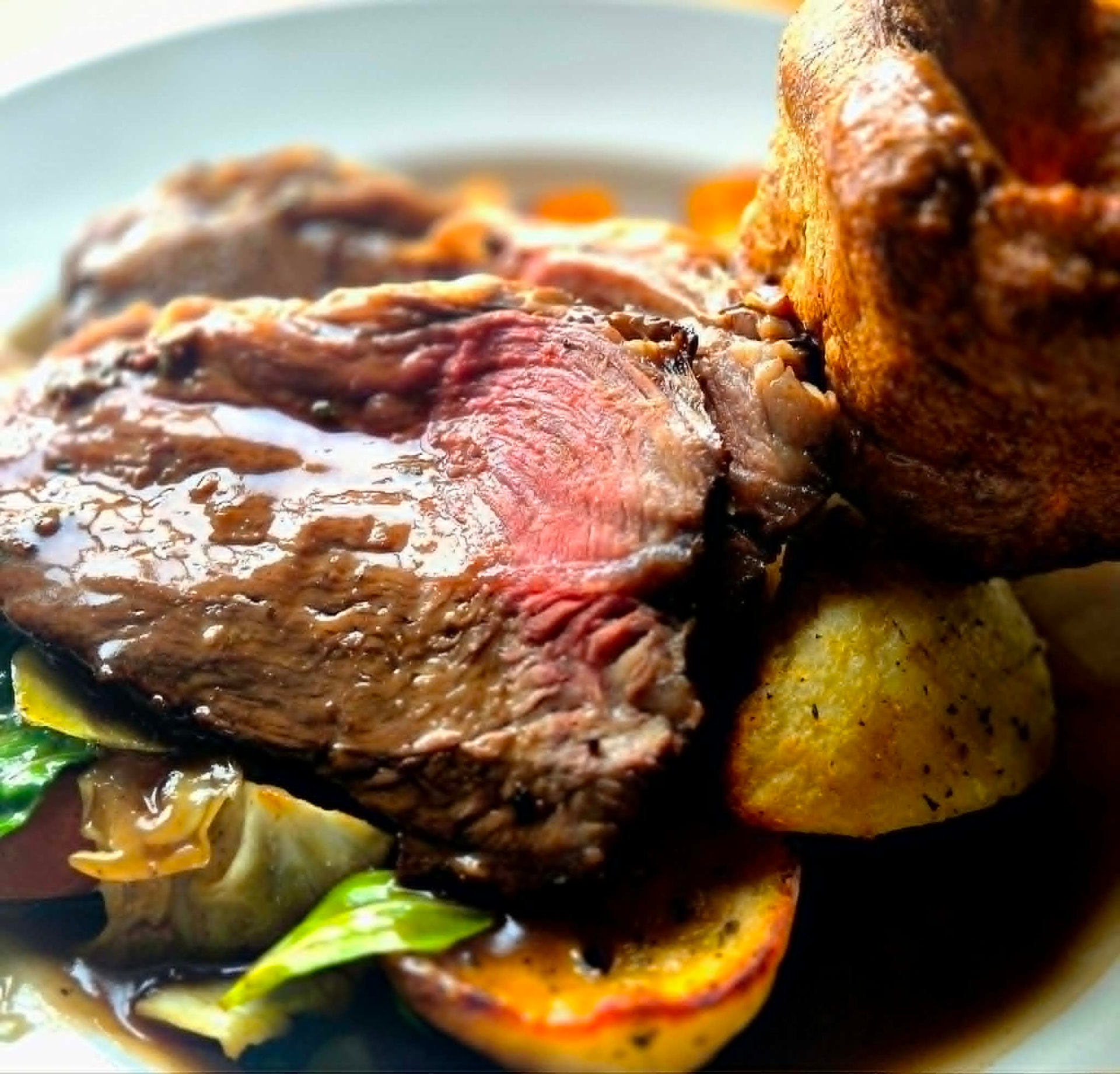 Sunday roast beef with a giant Yorkshire pudding, roast potatoes and rich gravy at The Wellington Inn